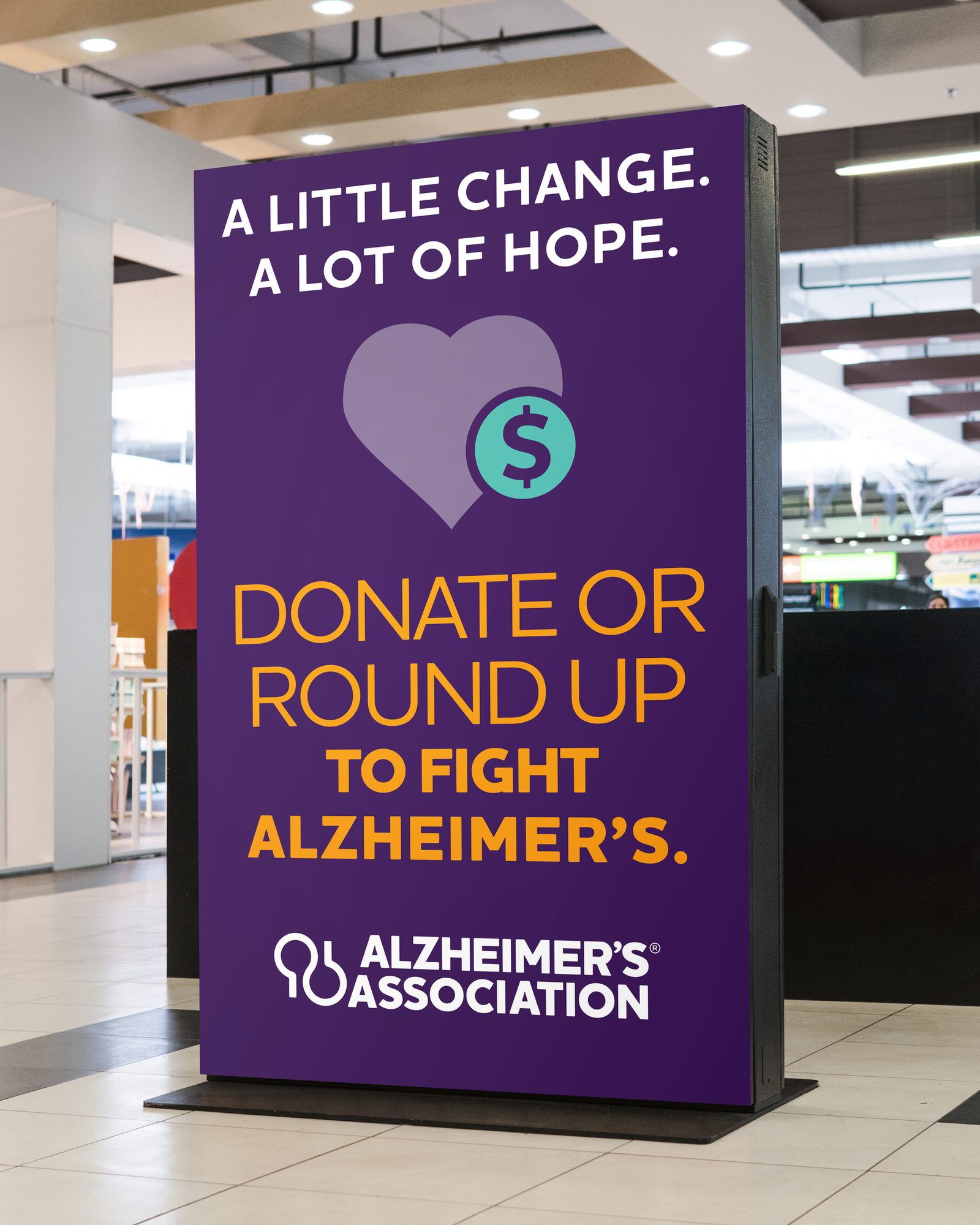 “A little change. A lot of hope.” donate-or-round-up display in a retail setting
