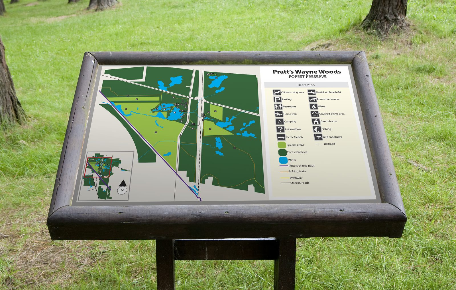Interpretive trail sign with a park map